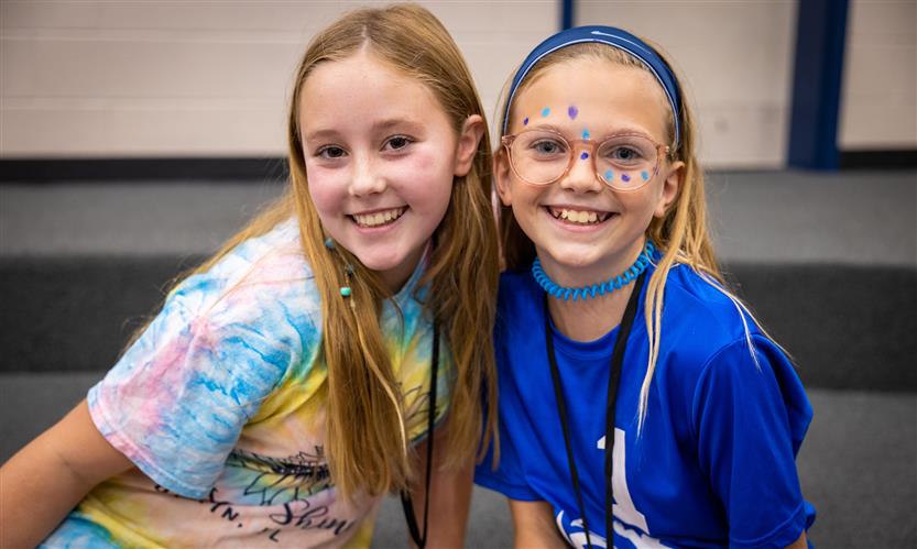 two girls smile